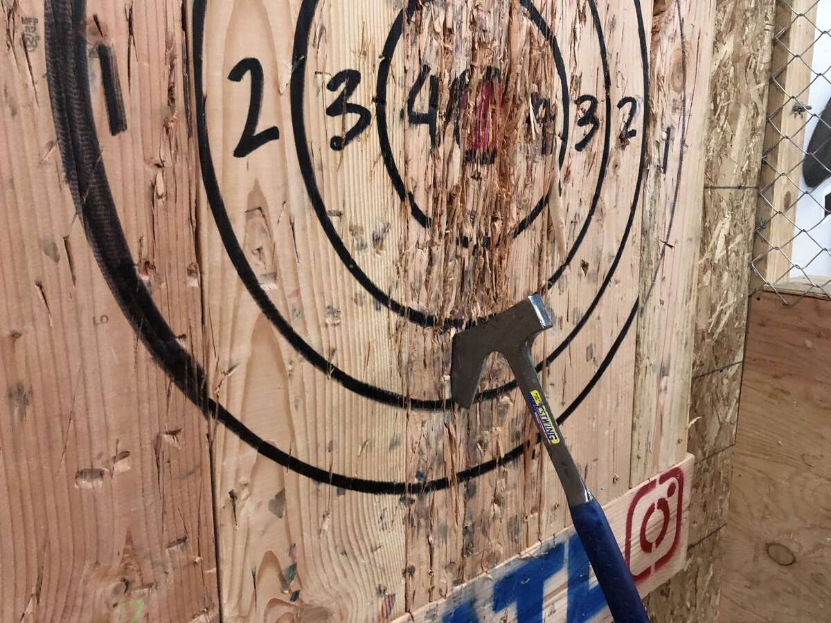 Here's what it's like to go ax throwing, that lumberjack sport popping