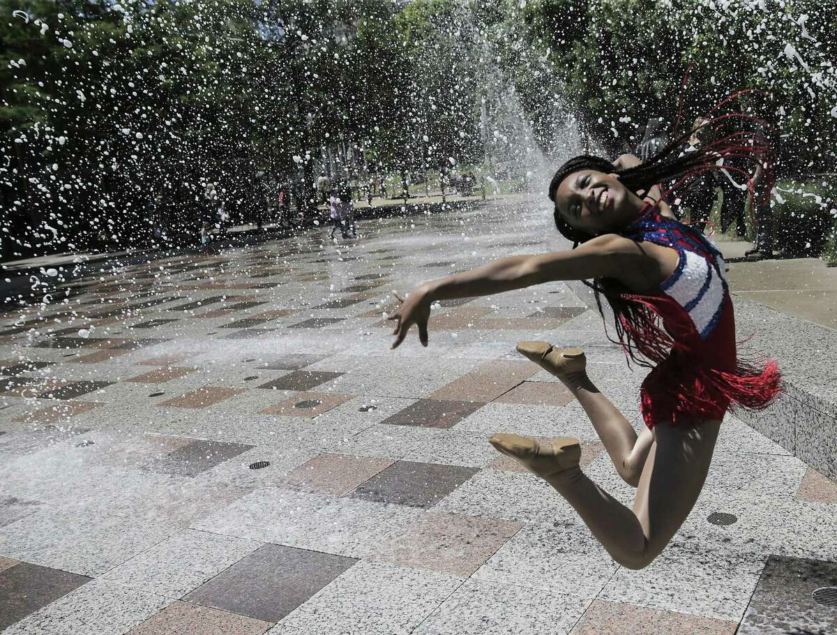 Faith Ward, a junior Ramette at Kashmere High School, poses for a photo in the splash pad during Discovery Green's 10th year celebration on Sunday, April 15, 2018, in Houston. The Houston schoo's marching band performed during the celebration. ( Elizabeth Conley / Houston Chronicle )