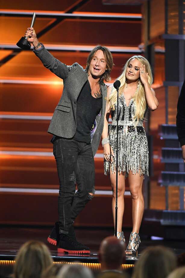 las vegas, nv - april 15: keith urban (l) and carrie underwood