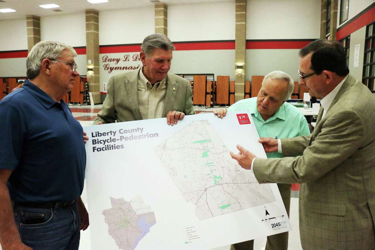 Pct. 2 Commissioner Greg Arthur, former county judge Lloyd Tookie Kirkham, and County Judge Jay Knight listen as HGACs Alan Clark shows proposed bicycle-pedestrian facilities for Liberty County in the 2045 Regional Transportation Plan.