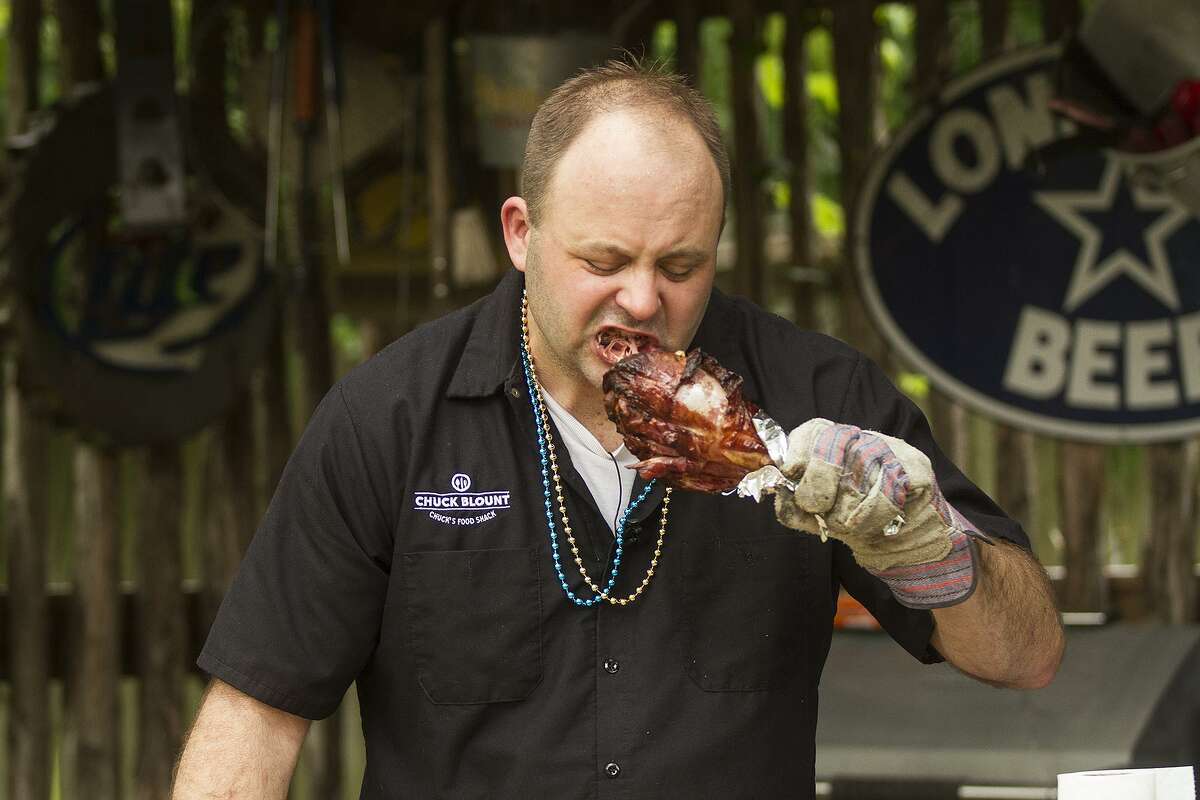 Chuck Blount takes a bite out of a smoked Fiesta style turkey leg.