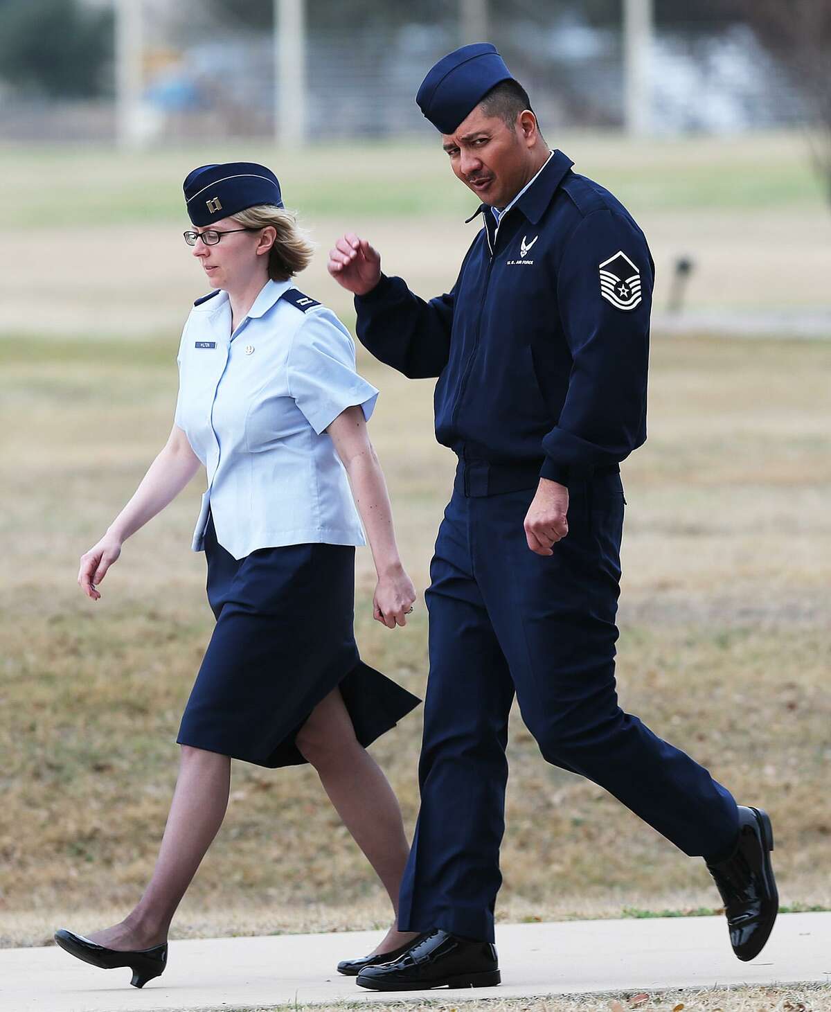 U.S. Air Force Master Sgt. Michael Silva, right, leaves an Article 32 hearing at Lackland Air Force, Monday, Feb. 24, 2013 with Capt. Theresa Hilton, his military defense lawyer. Silva is charged with raping three women over the past 21 years. He faces life in prison if convicted.