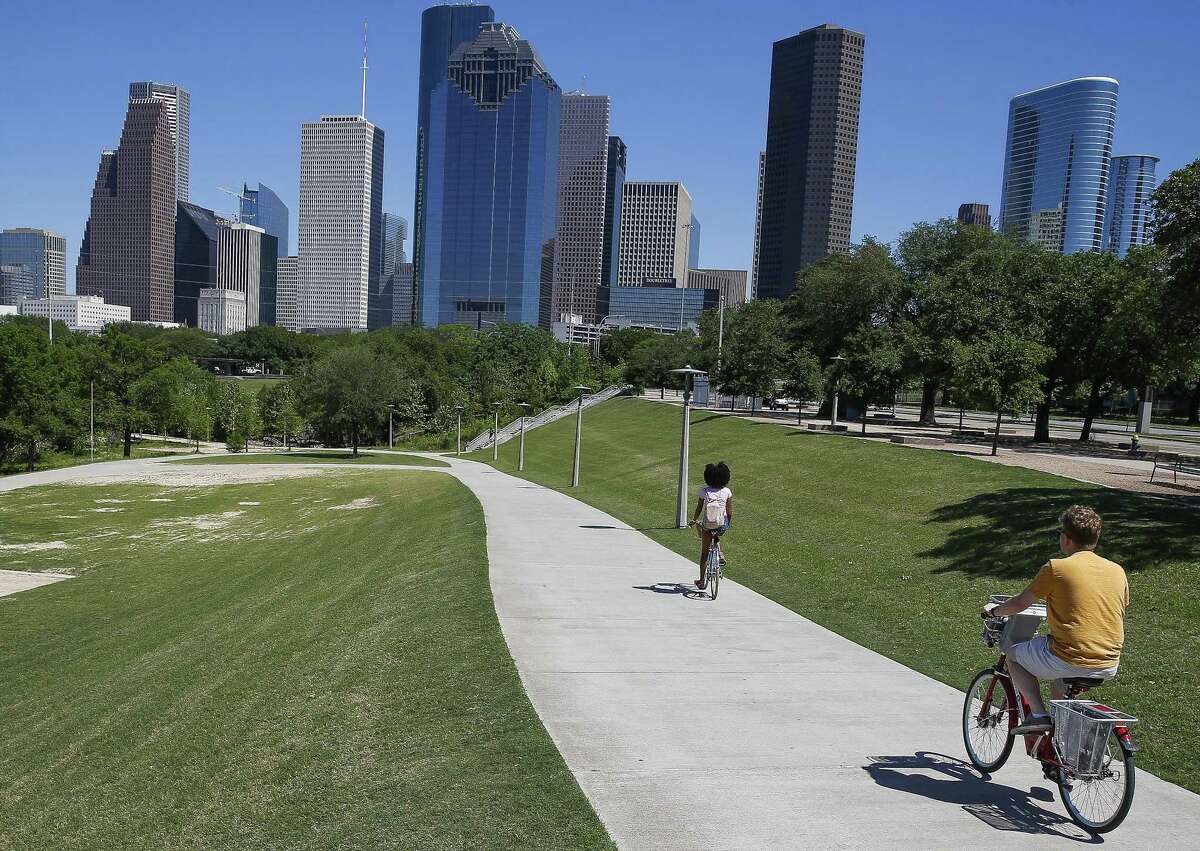 Cyclists ride through Buffalo Bayou Park next to Allen Parkway Monday, April 16, 2018 in Houston. A new partnership between city and county officials aims to improve bike and pedestrian access to downtown. (Michael Ciaglo / Houston Chronicle)