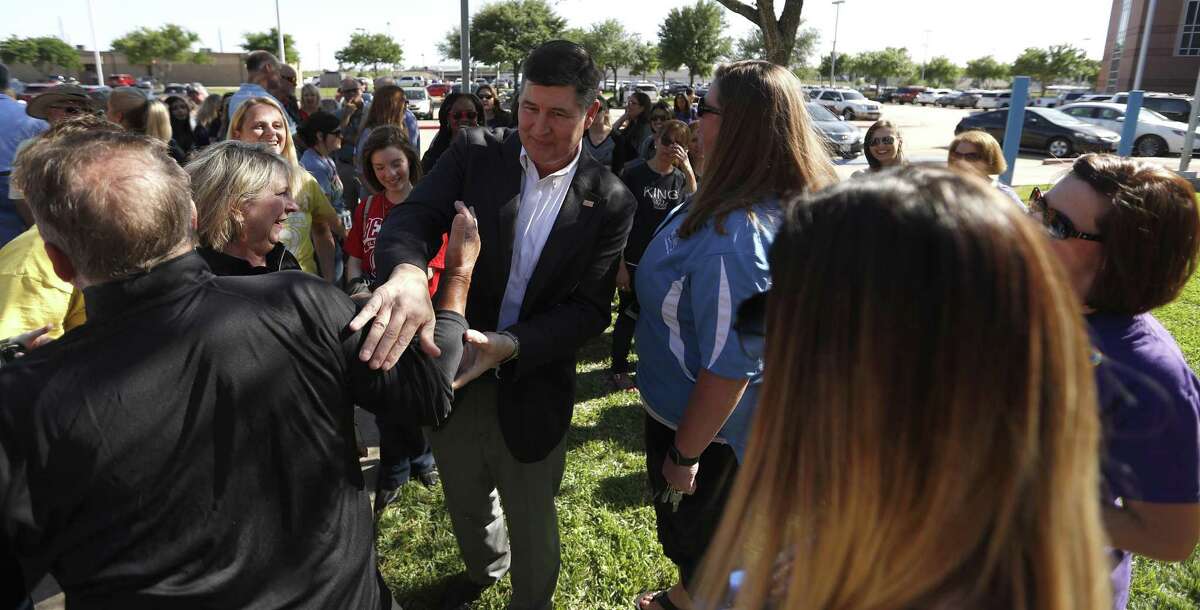 Katy ISD Superintendent Lance Hindt hugs a woman as he is surrounded by members of the Katy community who organized a support circle and rally before a board of trustees work-study meeting on April 16, 2018 in Katy. Based on the book “The Circle Maker” by Pastor Mark Batterson, the event sought to uplift Dr. Hindt through the power of positivity.