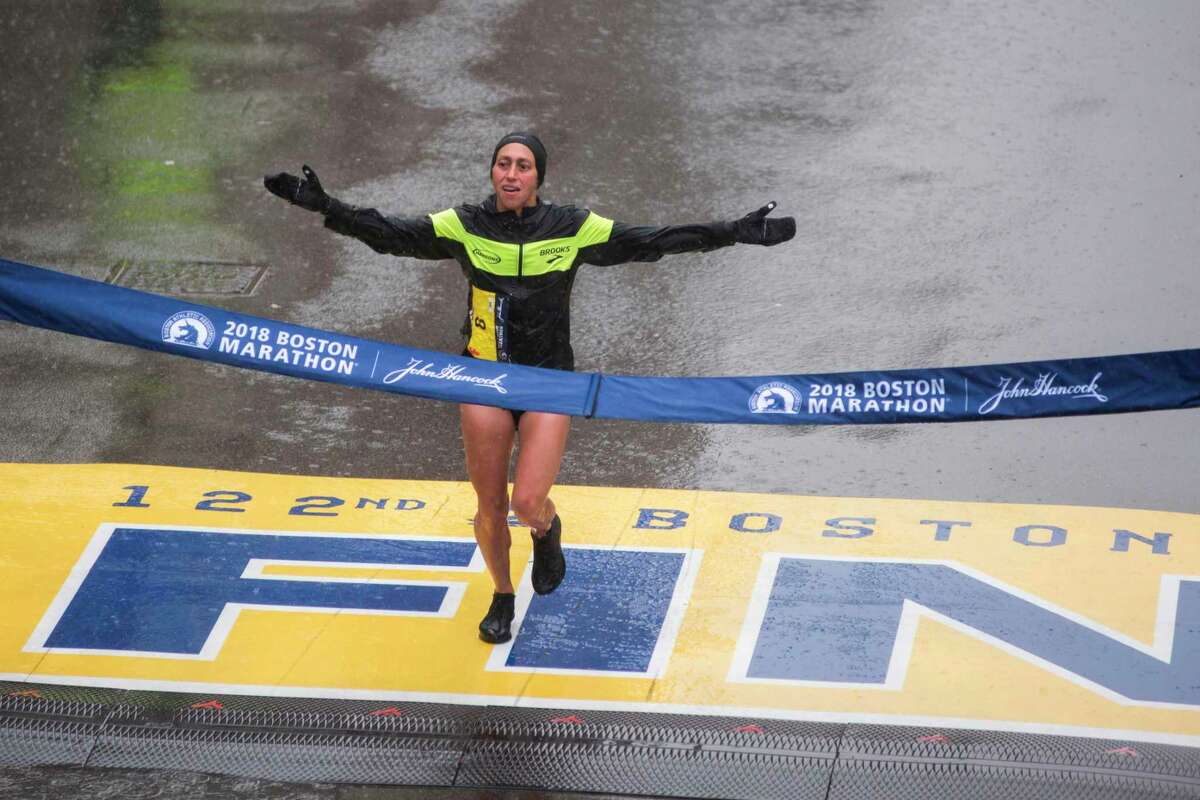 Desiree Linden of the United States crosses the finish line as the winner of the 2018 and 122nd Boston Marathon for Elite Women's race with a time of 2:39:54 on April 16, 2018 in Boston, Massachusetts. Her personal best finish was previously second place in the Boston Marathon in 2011 with a time of 2:22:38. / AFP PHOTO / RYAN MCBRIDERYAN MCBRIDE/AFP/Getty Images