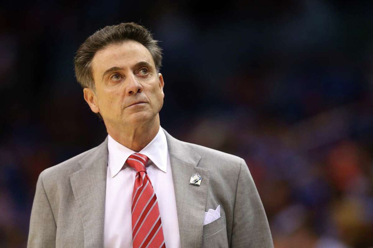 A friend to Rick Pitino, shown coaching the Louisville Cardinals, says he'd be interested coming to Siena College. But would he be a good fit for the Catholic school in Loudonville? (Photo by Dylan Buell/Getty Images)