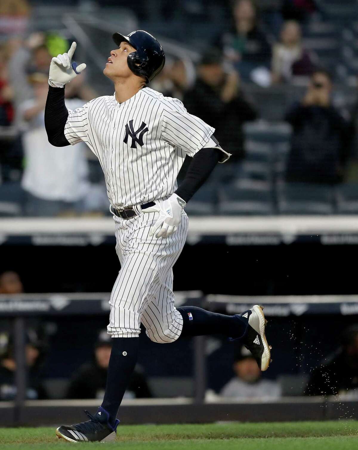NEW YORK, NY - APRIL 16: Aaron Judge #99 of the New York Yankees celebrates his solo home run in the second inning against the Miami Marlins at Yankee Stadium on April 16, 2018 in the Bronx borough of New York City. (Photo by Elsa/Getty Images)