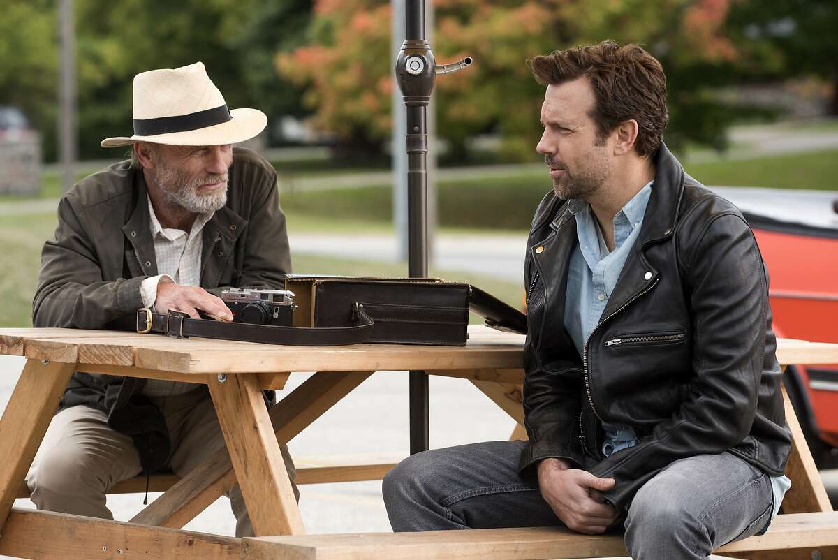 This image released by Netflix shows Ed Harris, left, and Jason Sudeikis in a scene from "Kodachrome." (Christos Kalohoridis/Netflix via AP)