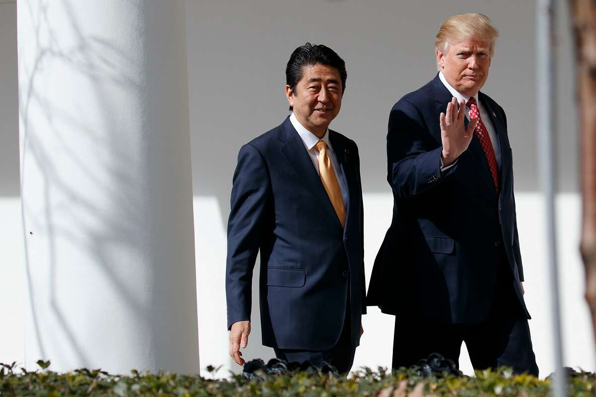 FILE - In this Feb. 10, 2017, file photo, Japanese Prime Minister Shinzo Abe, left, walks with U.S. President Donald Trump for a news conference at the White House in Washington. Abe is heading to Trump�s Mar-a-Lago resort Tuesday, April 17, 2018 for two days of talks, hoping to keep Japan�s interests on the table in a possible U.S.-North Korea summit as well as stem a slide in his voter support ratings. (AP Photo/Evan Vucci, File)
