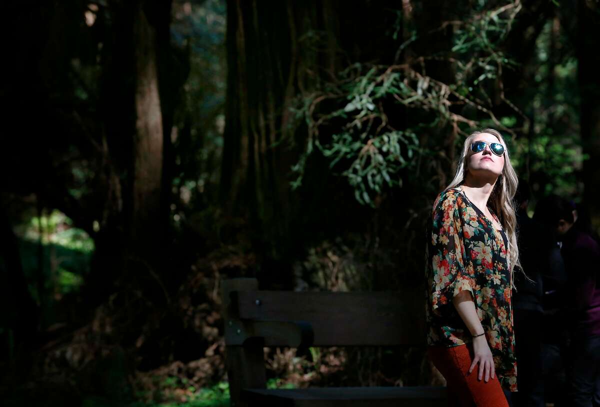 Visiting from Boston, Alissa Gutowski takes in the view of old growth redwoods at Muir Woods National Monument in Mill Valley, Calif. on Tuesday, April 17, 2018. Gutowski, traveling with her friend Heather Ford, said redwood trees and the Golden Gate Bridge were the two must-sees during their visit. The Save the Redwoods League has released its first ever State of Redwoods Conservation Report.