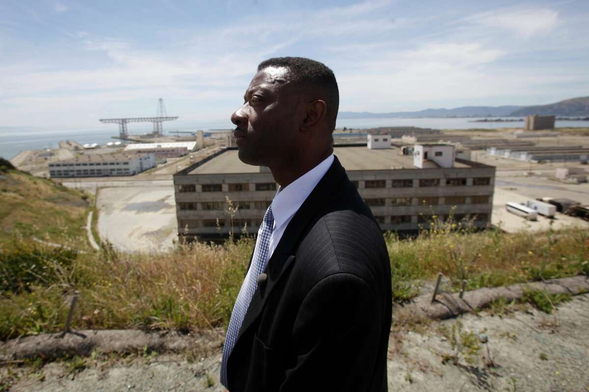 Kofi Bonner Regional Vice President Bay Area Division Lennar Urban, stands on top of the Hilltop community with the site of the proposed NFL stadium and other parts of the Hunters Point Shipyard redevelopment project behind him in San Francisco, Calif. on Wednesday June 2, 2010.