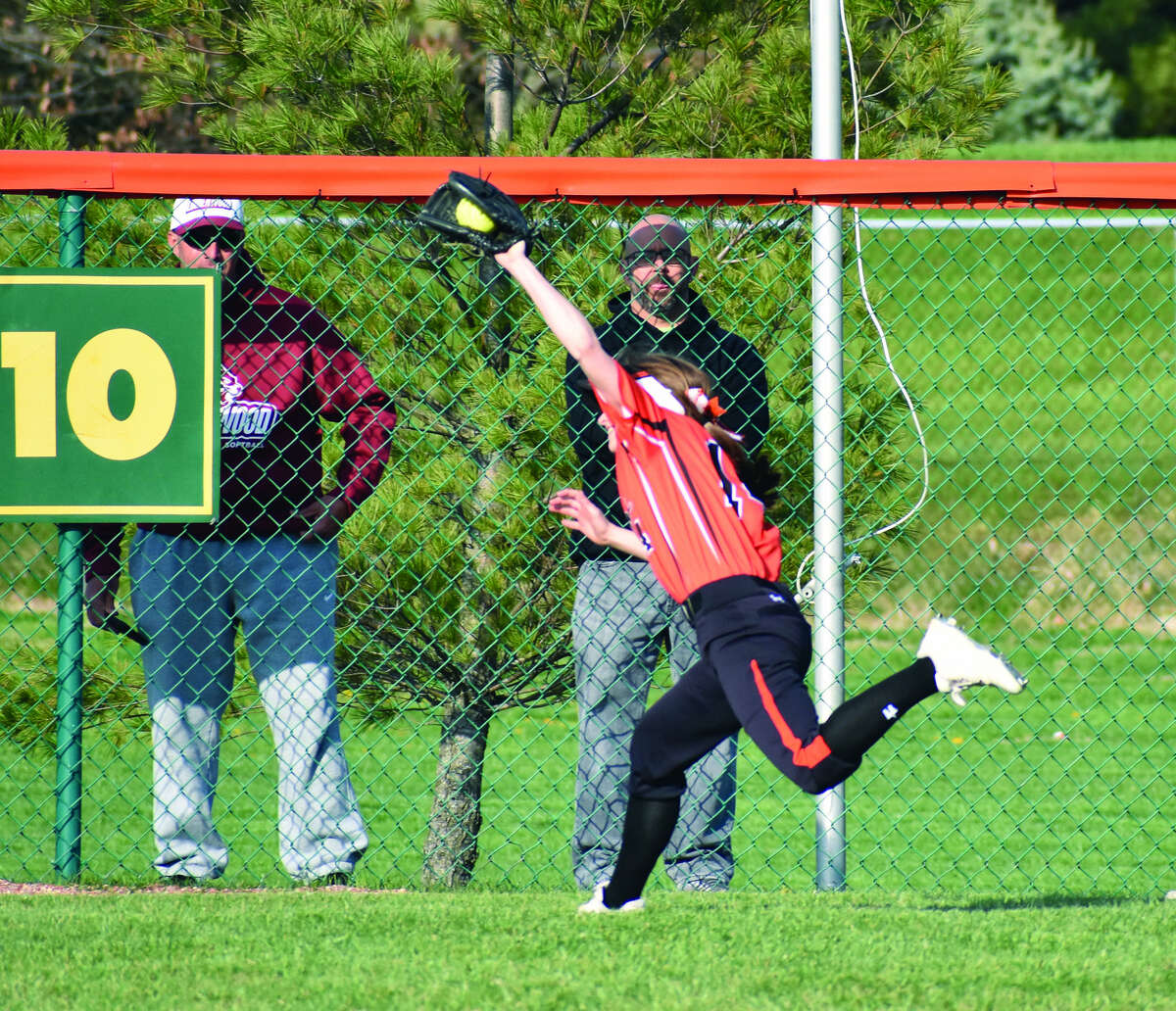 Edwardsville center fielder Lauren Taplin makes a catch just before the warning track in the outfield during the sixth inning of Tuesday’s game.