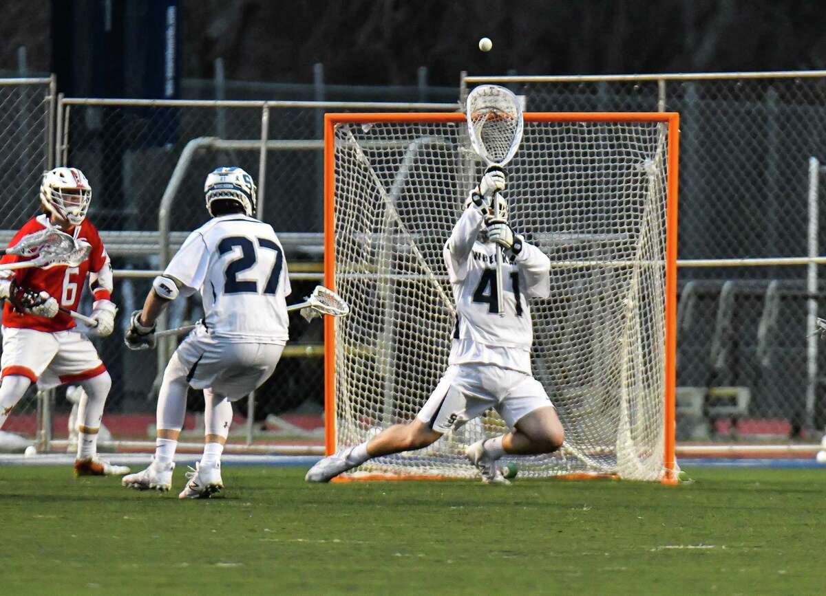 Staples goalie Matthew Garber makes a save during a game against Greenwich on Tuesday at Staples High School in Westport. Greenwich won 9-6.