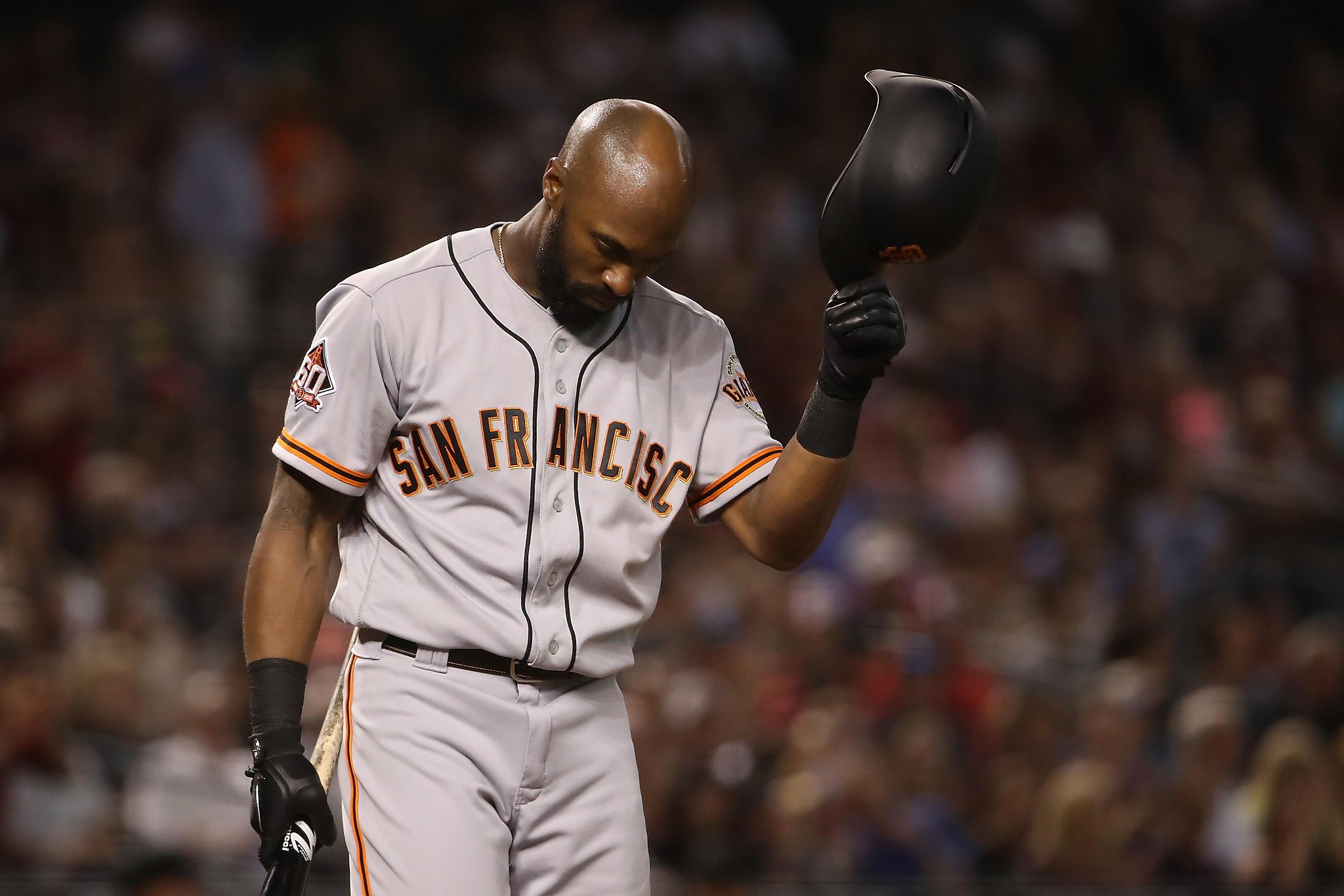 San Francisco Giants Barry Bonds, #25, reacts after getting hit by