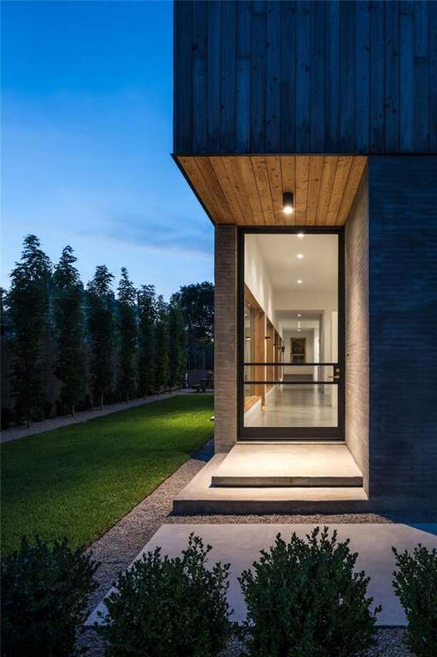 upper kirby home is barn on the outside, slick on the inside