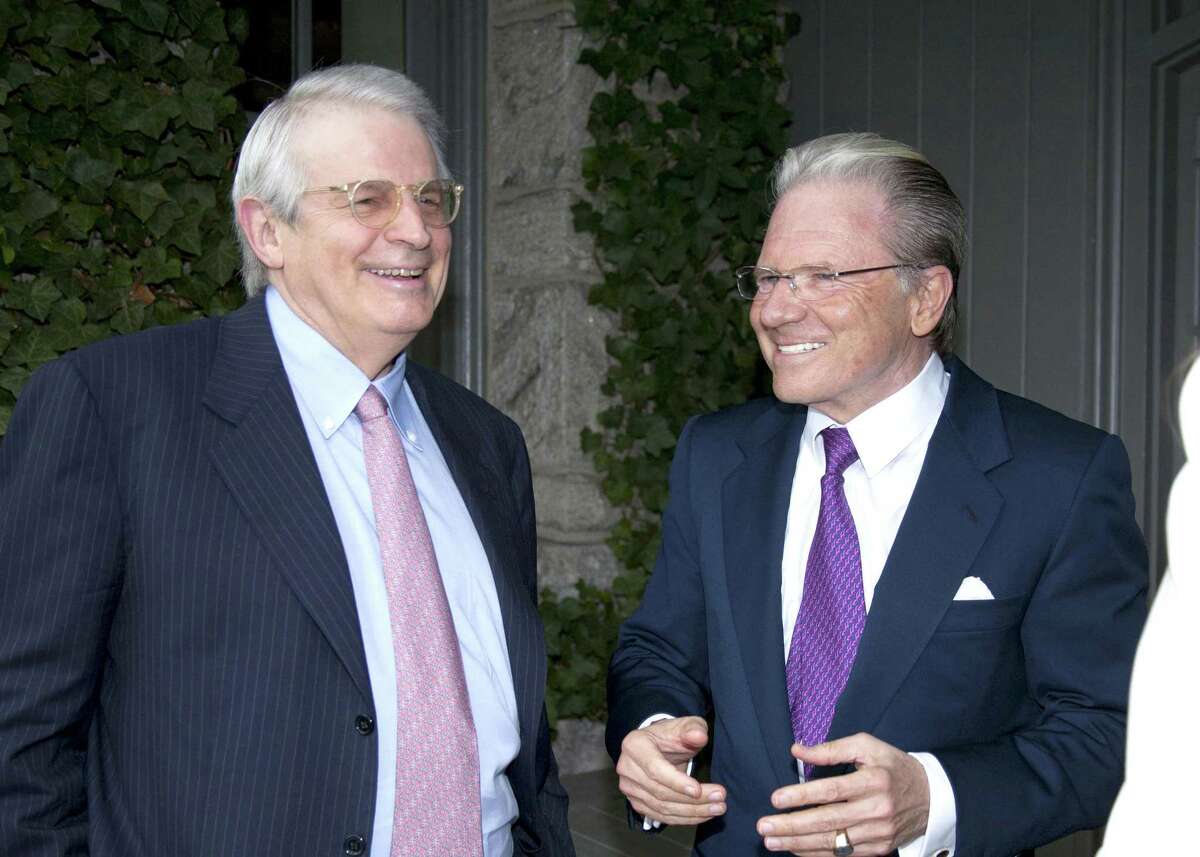 Interactive Brokers CEO Thomas Peterffy, right, in 2011 in Greenwich, Conn., alongside David Stockman.