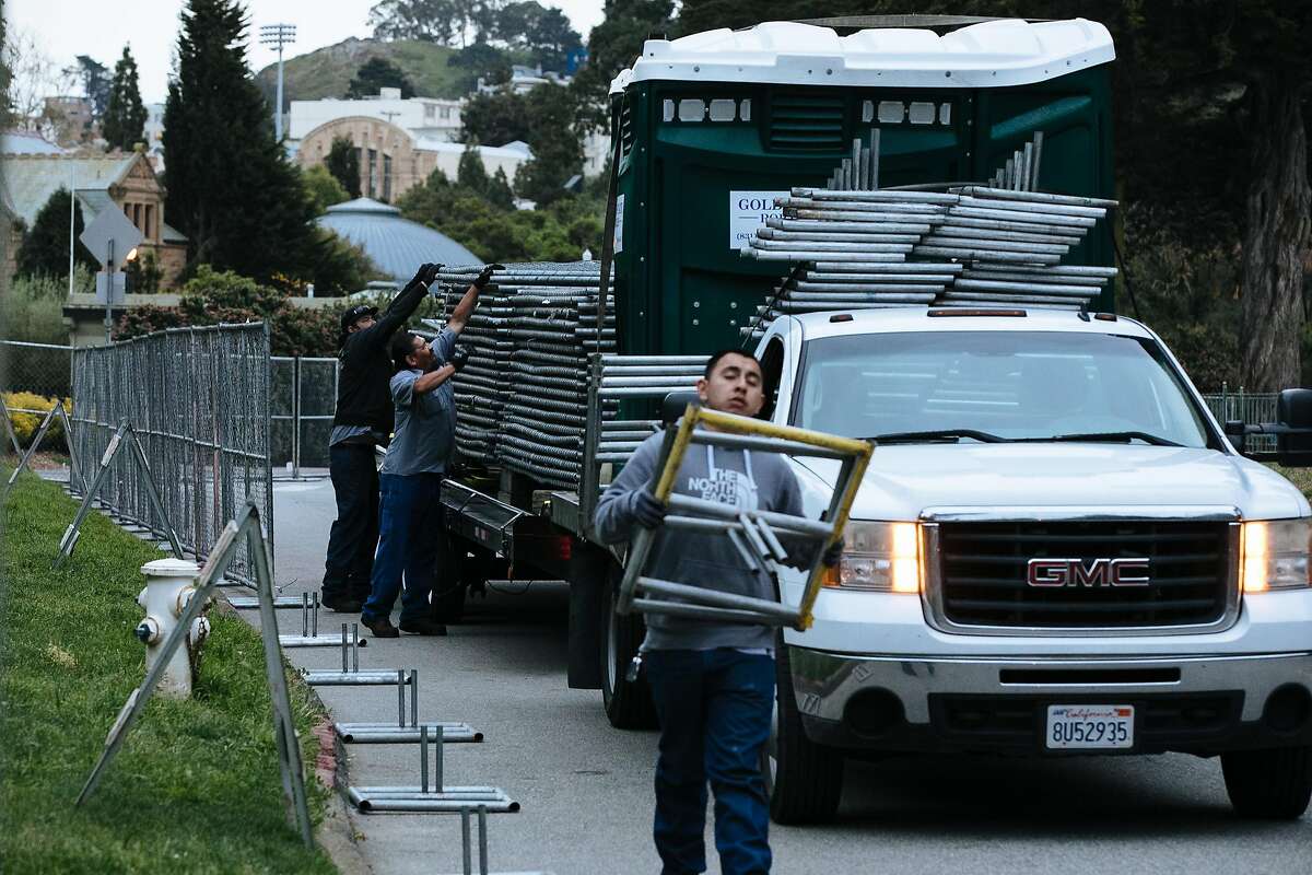 Crew begin to installs fencing on Bowling Green Drive in preparation for this weekend's annual 420 celebration at Golden Gate Park.