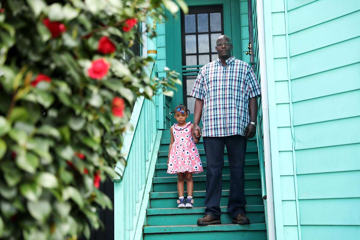 Dante Zedd and his daughter Addie, 5, pose on the steps of Dante's mother's house in the Dogtown neighborhood of Oakland, Calif., on Sunday, April 15, 2018.