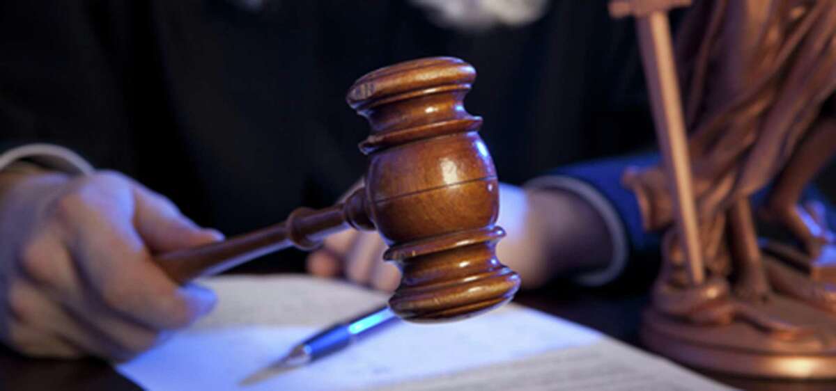 Male judge in a courtroom striking the gavel (Dreamstime/TNS)