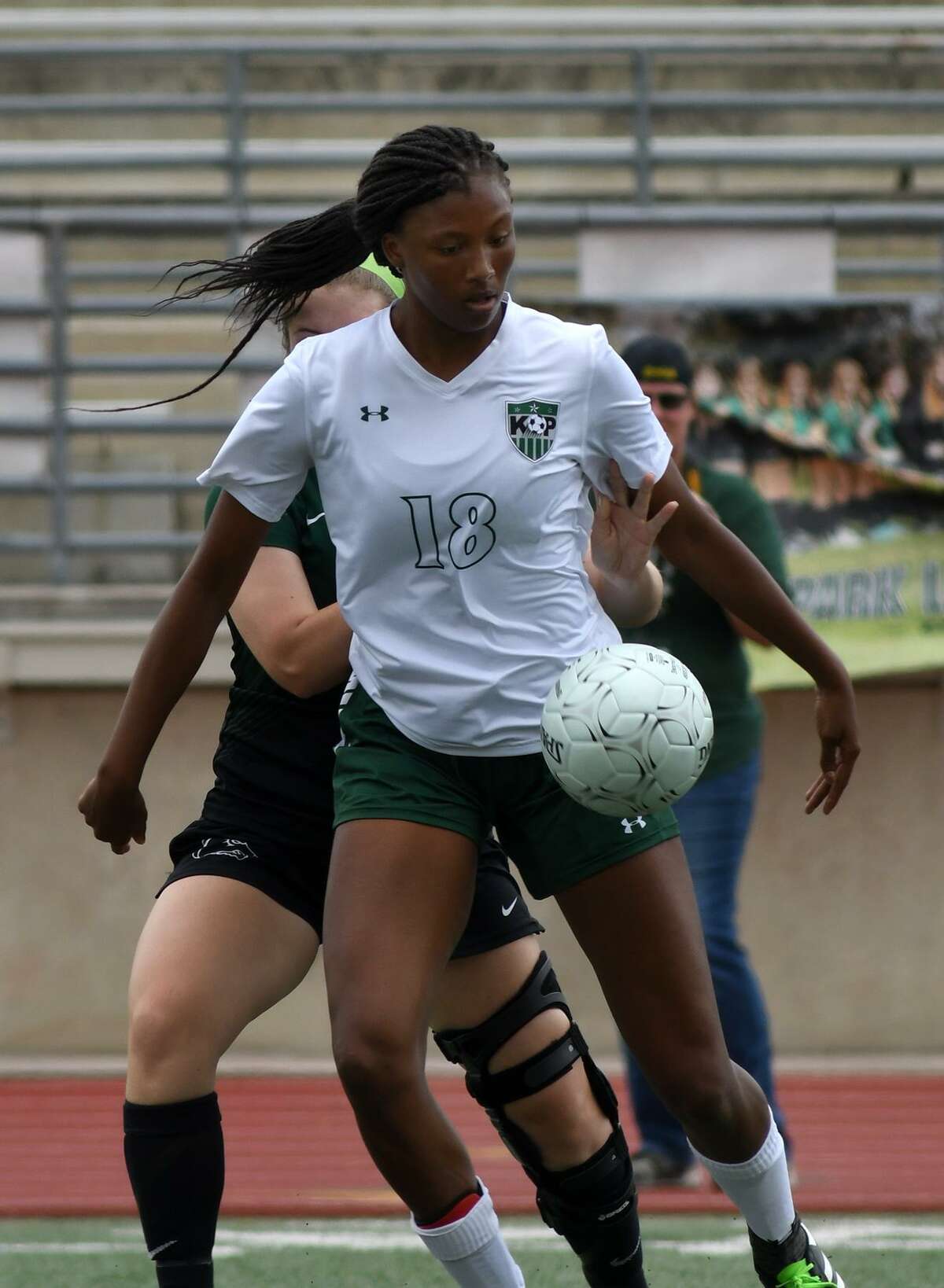 Kingwood Park junior midfielder Allie Byrd (18) makes a play against Cedar Park junior defender Ainsley Forbes during the first half of their UIL Region III-5A Girls Soccer semi-final matchup at Turner Stadium on April 13, 2018. (Photo by Jerry Baker/Freelance)