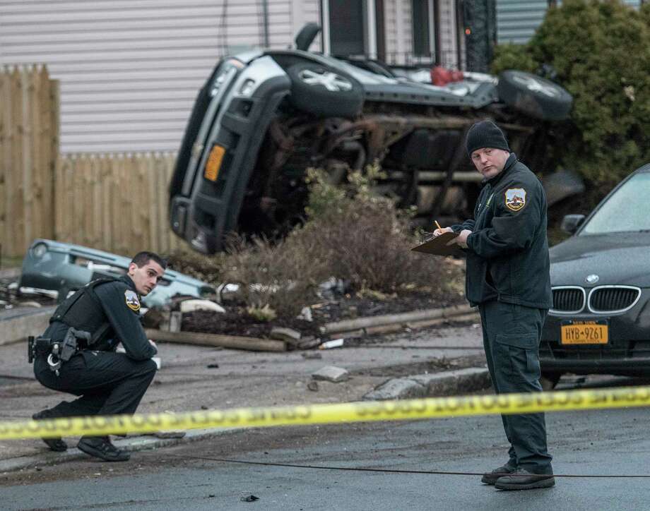 Schenectady Police are investigating an accident that caused damage to multiple houses and sent three people to local hospitals early Thursday April 19, 2018 in Schenectady, N.Y.  (Skip Dickstein/Times Union) Photo: SKIP DICKSTEIN, Albany Times Union