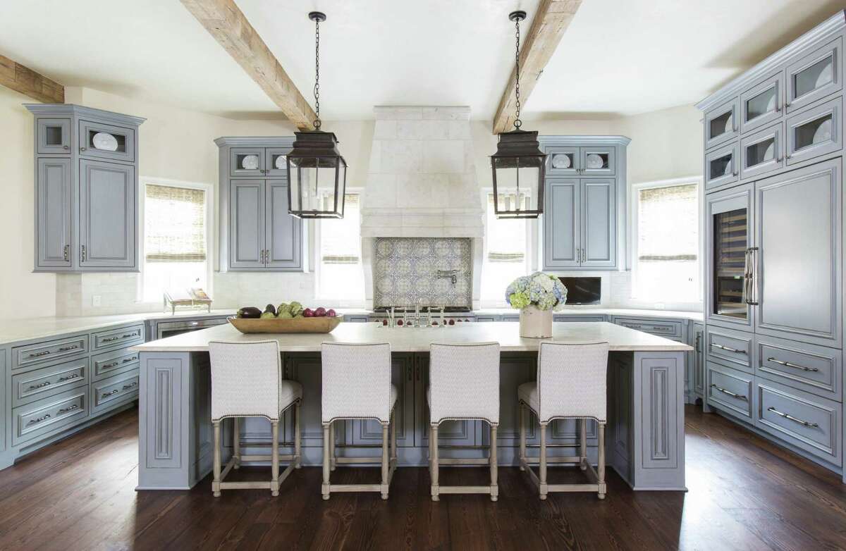 A softer blue adds personality to cabinets in this kitchen.