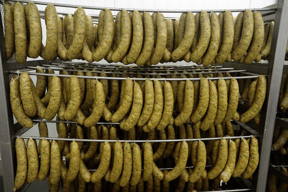 links of boudin hang on racks at the d.j.