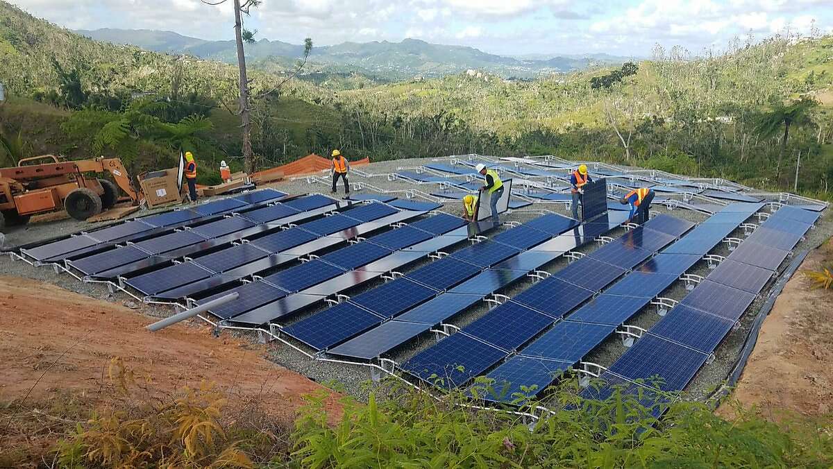 FILE-- Tesla said over 1,000 Tesla batteries were on the ground in Puerto Rico delivering power at 662 locations. In the hours after Puerto Rico went dark, Elon Musk, co-founder and CEO of Tesla, tweeted Wednesday, “Tesla batteries are currently live & delivering power at 662 locations in Puerto Rico. Team is working 24/7 to activate several hundred more.”