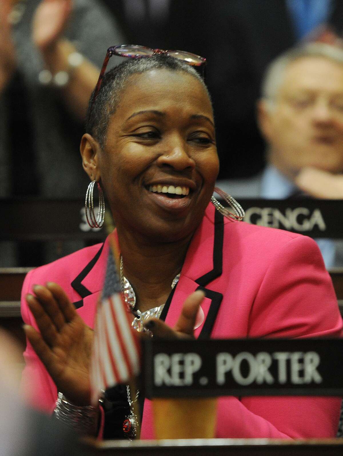 Rep. Robyn Porter, D-New Haven, applauds during the opening session of the state legislature at the Capitol in Hartford, Conn. on Wednesday, February 7, 2018. Chair of the Labor Committee, she championed a pay equity bill through the House on Wednesday, April 11, 2018.