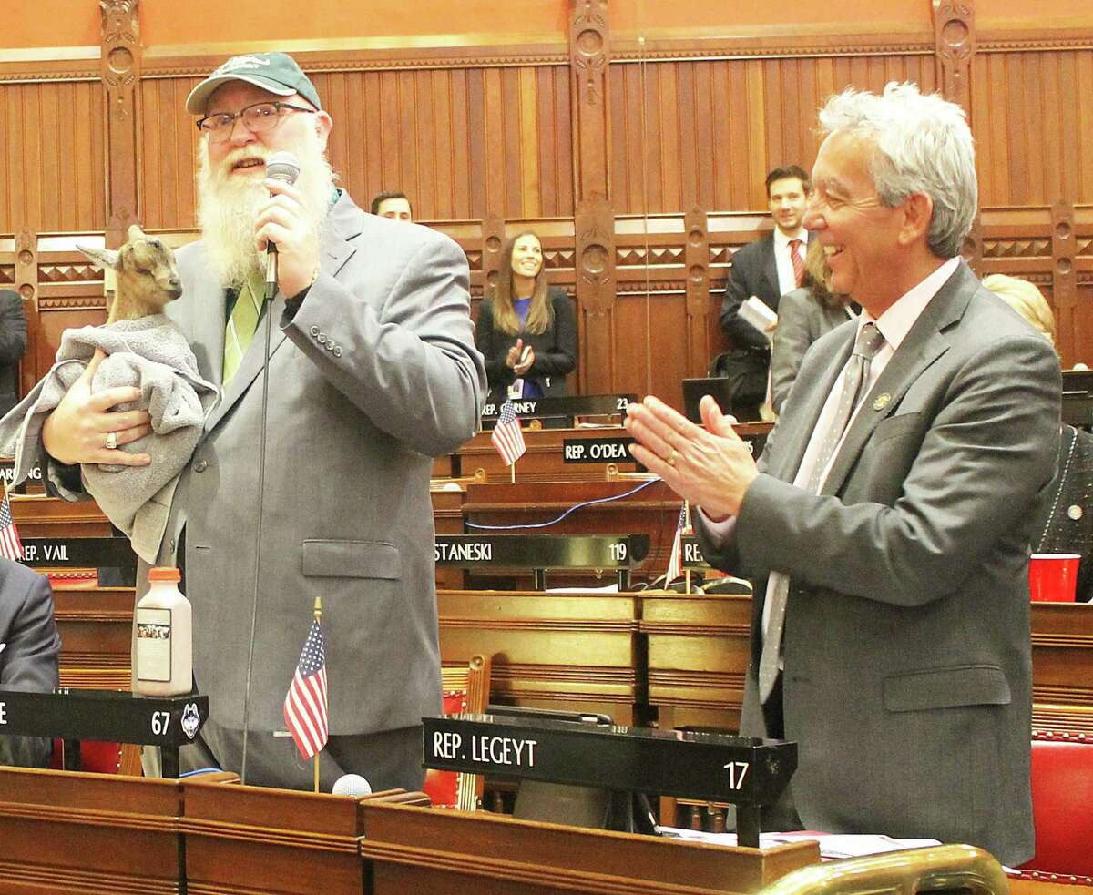 State representatives Bill Buckbee and Rich Smith introduce “Billy Mo” to the House of Representatives.