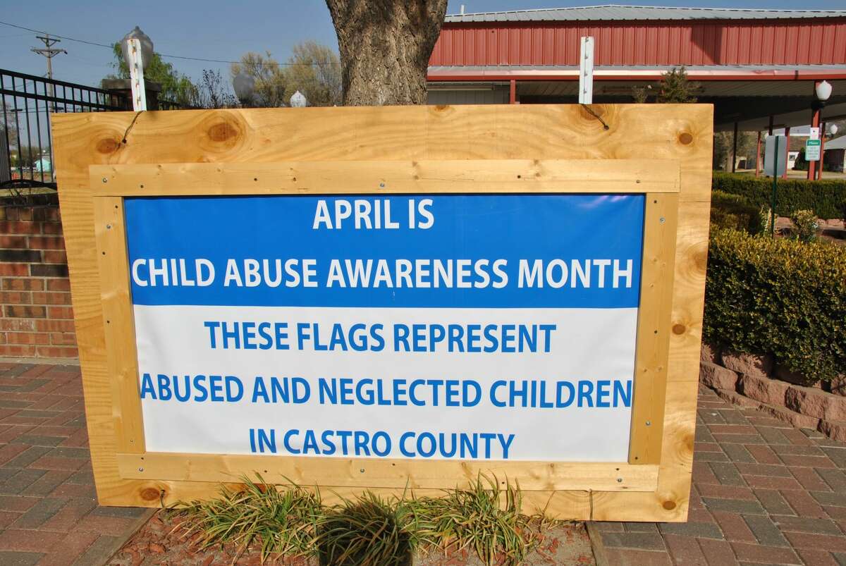 A large sign along with a variety of small blue flags have been placed outside the Centennial Pavilion in downtown Hart as a reminder that April is Child Abuse Prevention Month in Texas.