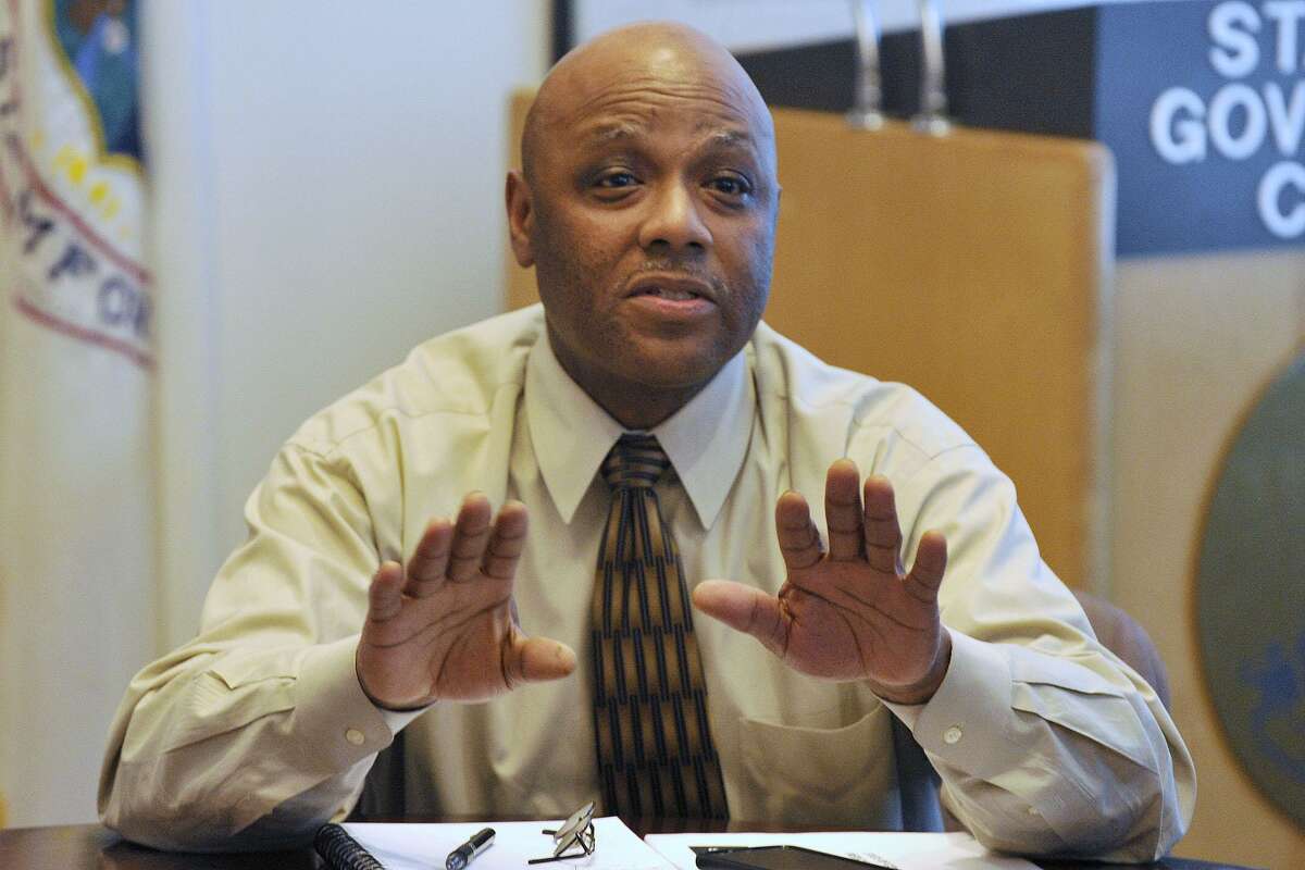 FILE PHOTO: Michael Pollard, the mayor's chief of staff, answers questions from residents concerned with the proposed marijuana dispensary on Magee Avenue during the Mayor's Night In event at the Stamford Government Center in Stamford, Conn., on Monday, March 31, 2014.