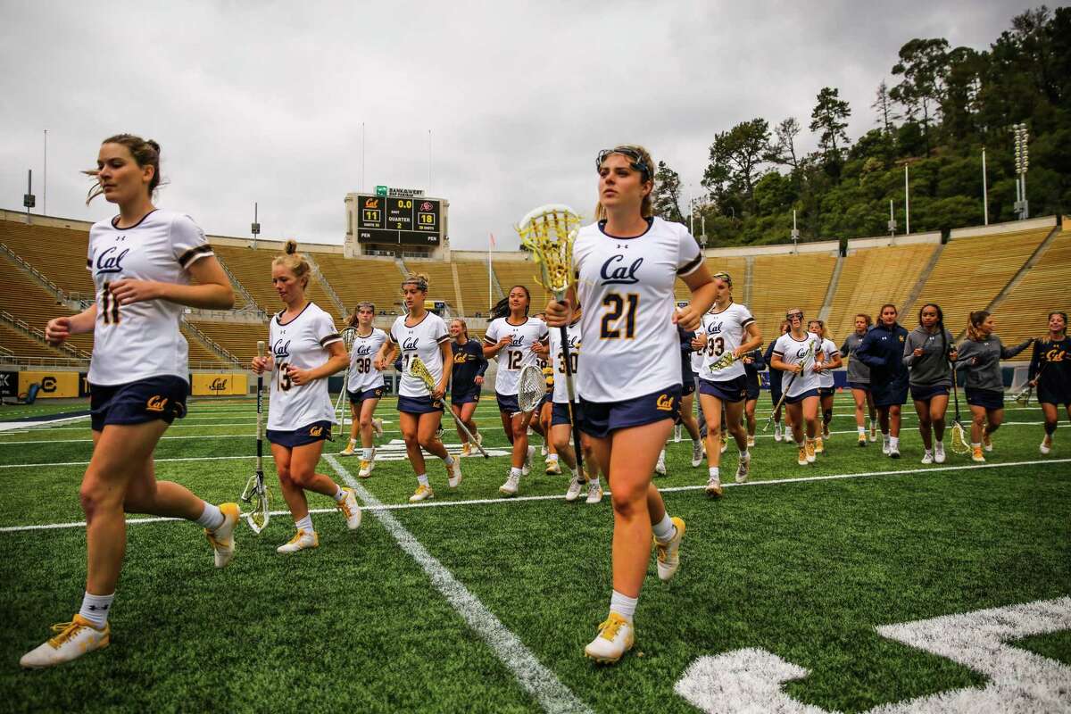 Cal women's lacrosse players walk off the field after a game between Cal and Colorado at California Memorial Stadium in Berkeley, California, on Sunday, April 15, 2018.