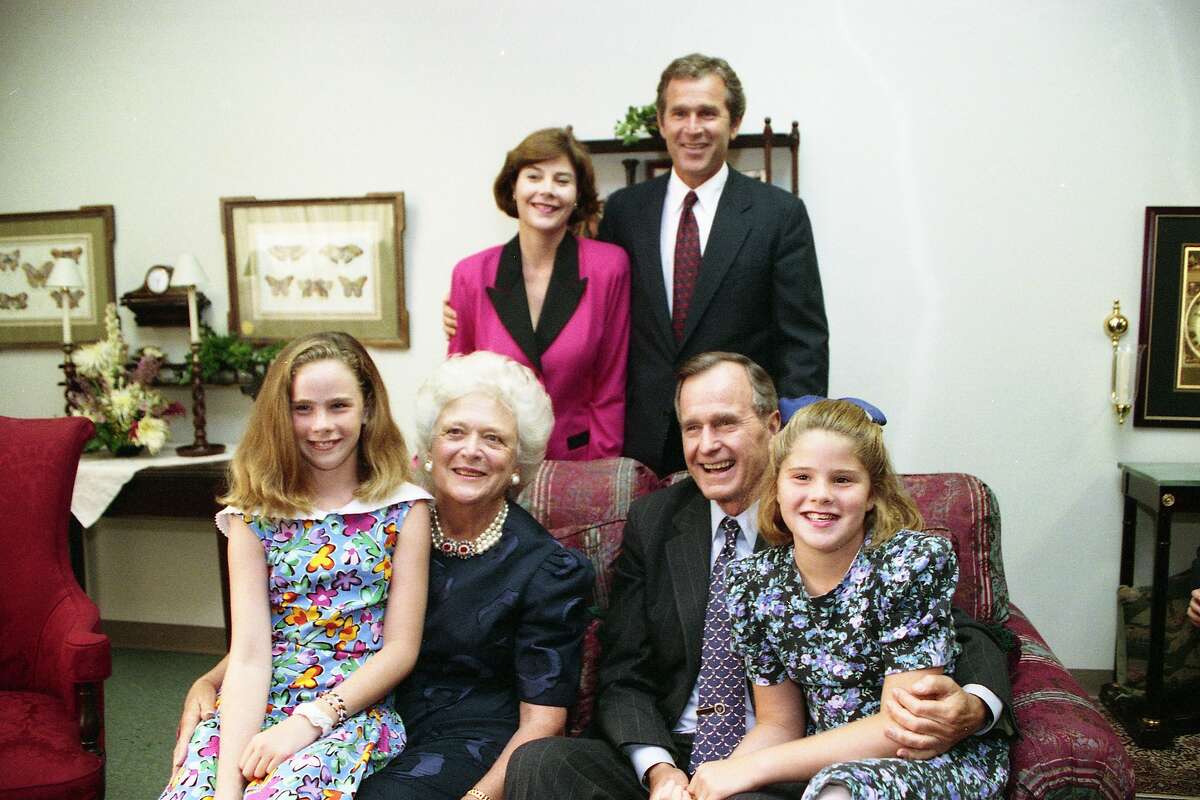 President George Bush poses with his family, clockwise from top left, Laura and George W. Bush, granddaughter Jenna, first lady Barbara Bush and granddaughter Laura in August 1992 during the GOP convention in Houston. 