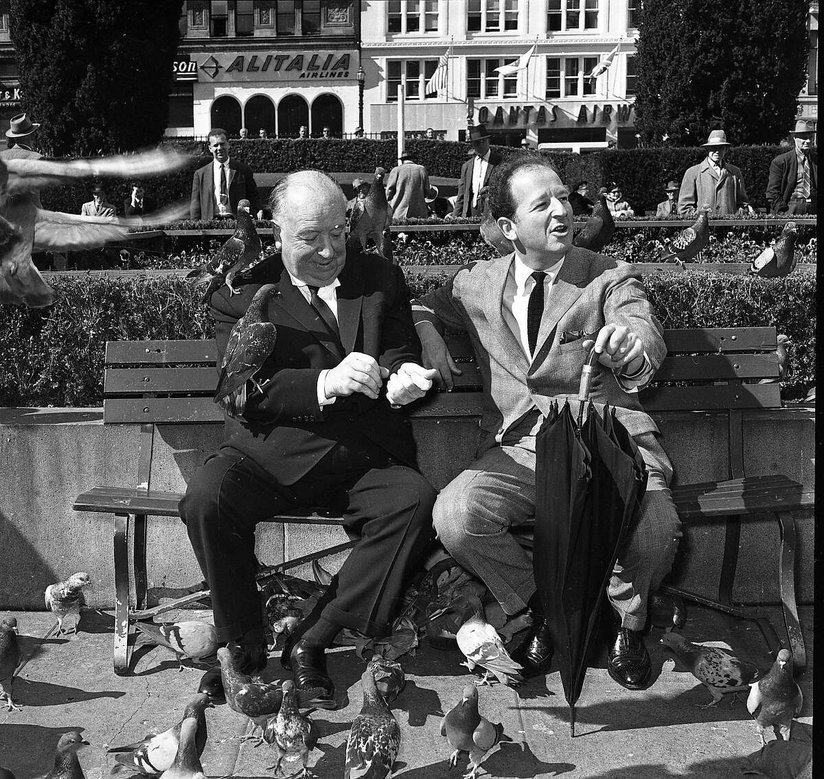 April 1, 1963: Herb Caen and Alfred Hitchcock feed the pigeons in Union Square during a promotion for Hitchcock's movie "The Birds."