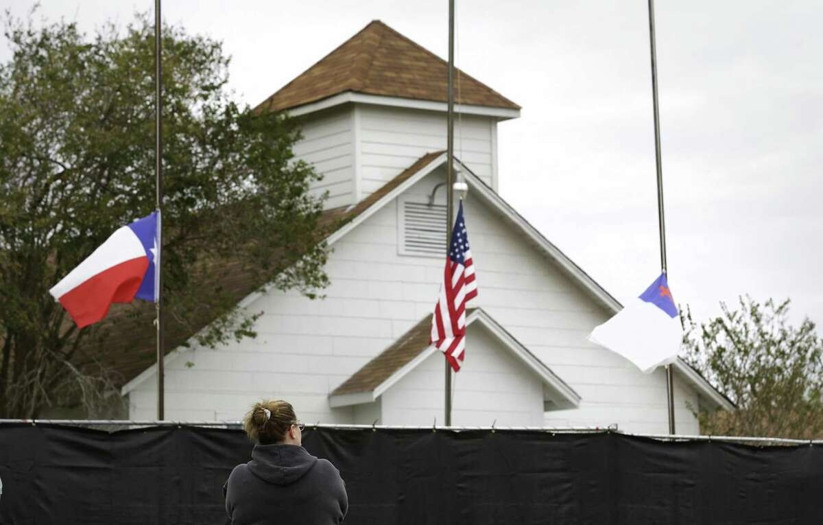 Tonya Brockman of San Antonio pays her respects as she visits the First Baptist Church in Sutherland Springs after a mass shooting there in November.