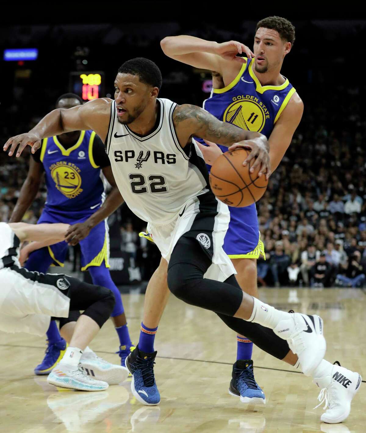 San Antonio Spurs' Rudy Gay drives to the basket past Golden State Warriors' Klay Thompson (11) during the first half of Game 3 of a first-round NBA basketball playoff series in San Antonio, Thursday, April 19, 2018. (AP Photo/Eric Gay)