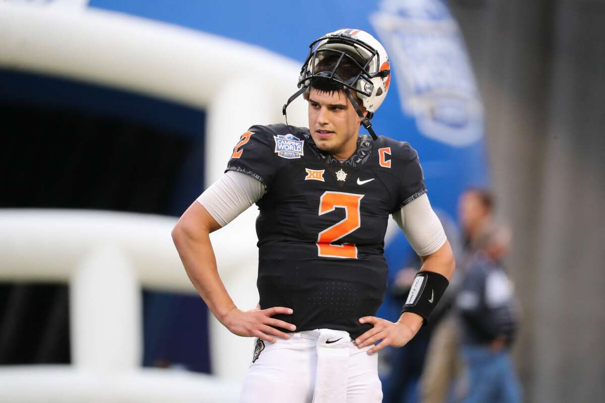 Oklahoma State Cowboys quarterback Mason Rudolph (2) warms up before the Camping World Bowl between the Virginia Tech Hokies and the Oklahoma State Cowboys on December 28, 2017.