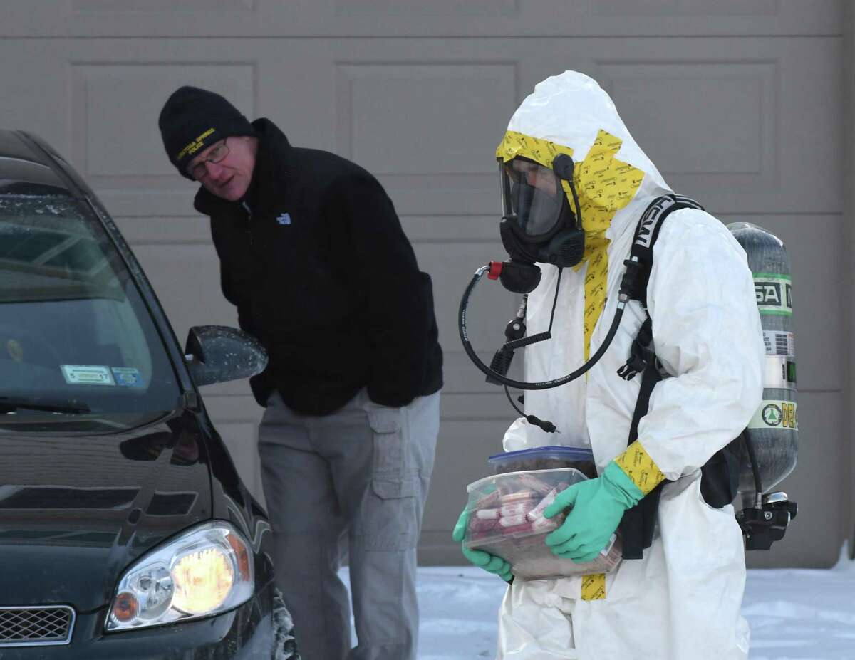 Evidence is collected from 16 Cherry St. on Friday, Feb. 10, 2017, in Saratoga Springs, N.Y. Fentanyl, a synthetic opioid painkiller that is 50 times as powerful as heroin, was found on surfaces inside the home that police raided before dawn on Friday, State Police said. (Will Waldron/Times Union)