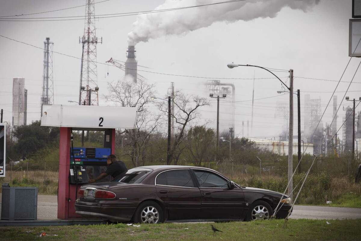 Steam comes from refineries near a gas station in Texas City, Texas in 2014. Pollution from such facilities add to a growing health crisis, but another main source comes from our vehicles, which means that pollution from these kills more people than traffic accidents.