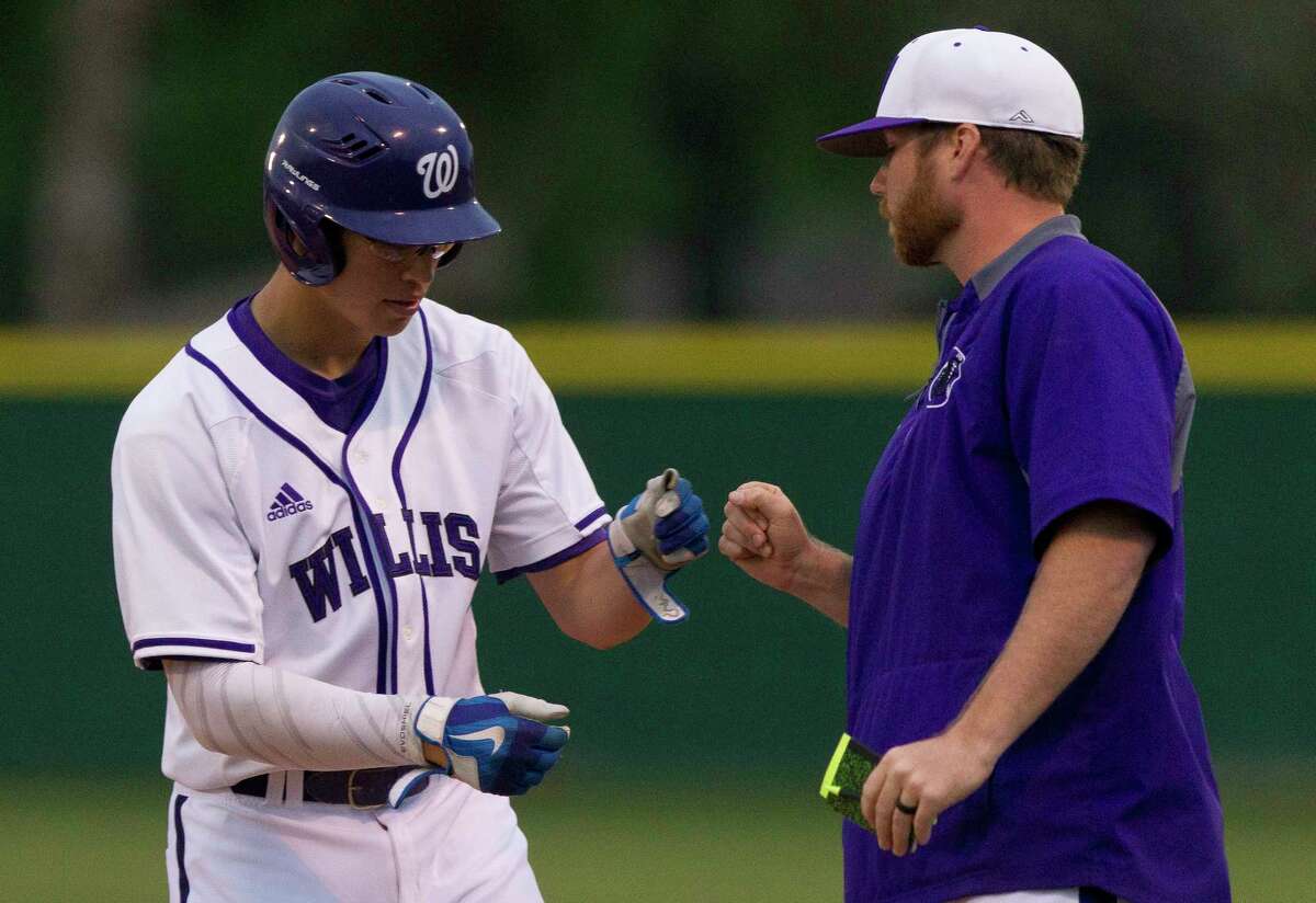 Brandon Birdsell #18 of Willis gets a fist-bump after hitting a single during the first inning of a District 20-5A high school baseball game, Thursday, March 15, 2018, in Willis.