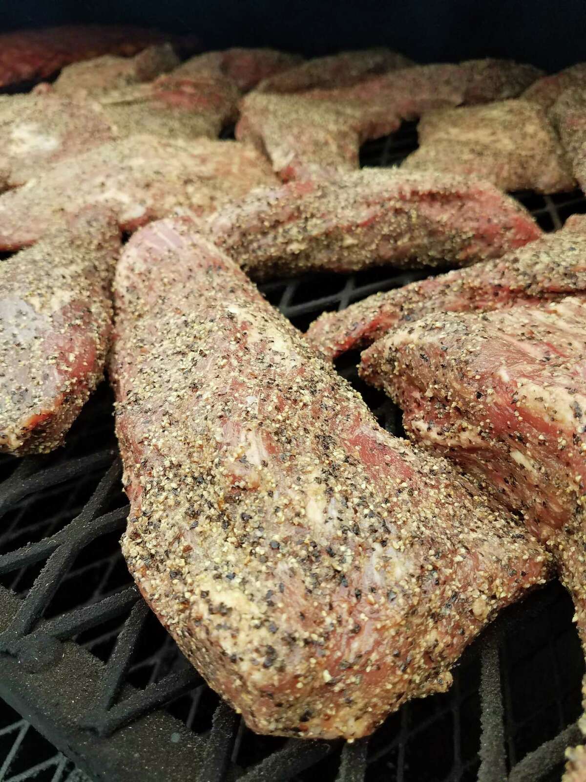 Seasoned tri-tip in the smoker at Victorian’s Barbecue.
