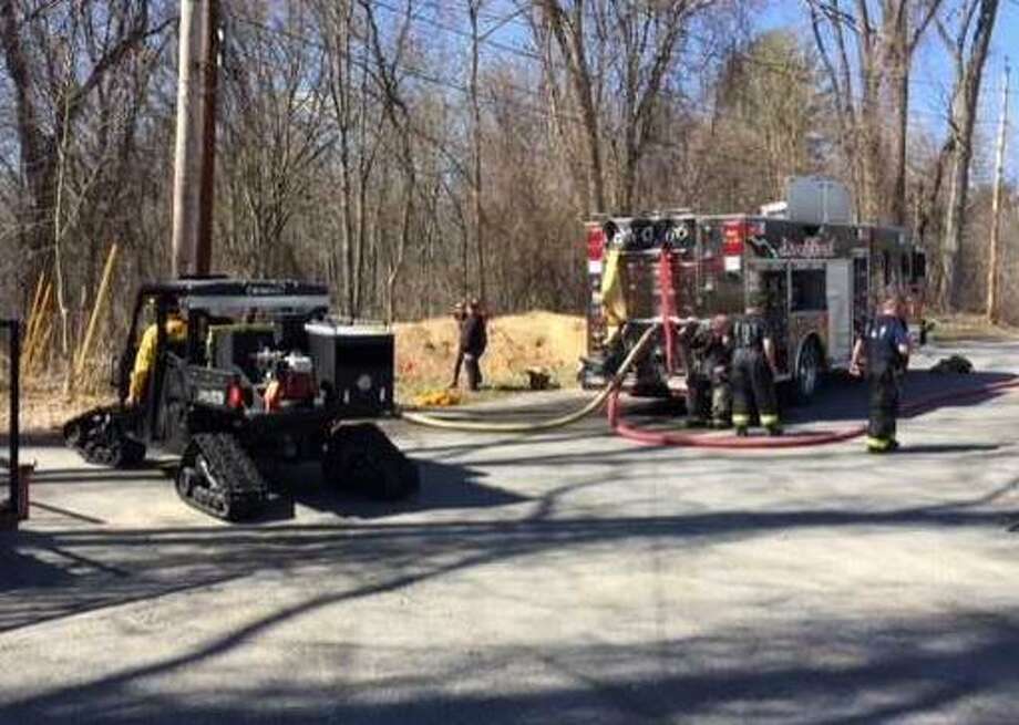 Special tracked vehicles were used to access a brush fire in the woods behind Schoolhouse road in Guilderland on Saturday. Officials across the state are warning that the dry conditions in the early spring can be the ingredients necessary to start brush fires. (Rick Karlin / Times Union) Photo: Karlin, Rick