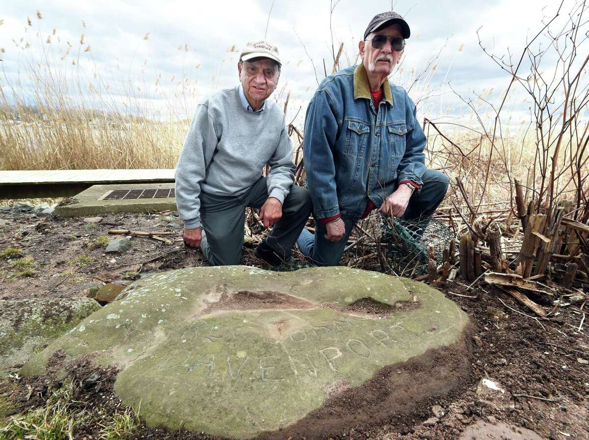 Charlie Salerno (left) and Anthony Griego by a boundary stone marking a border of the Rev. John Davenport's farm near the banks of the Quinnipiac River in New Haven.