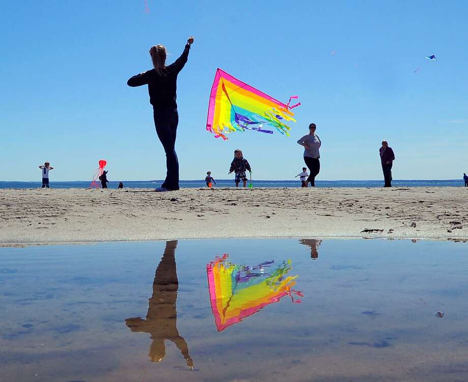 Spring Is In The Air As Kites Take Flight At Greenwich Point A Multi Colored Kite Is Reflected In Tidal Pool During The Annual Greenwich