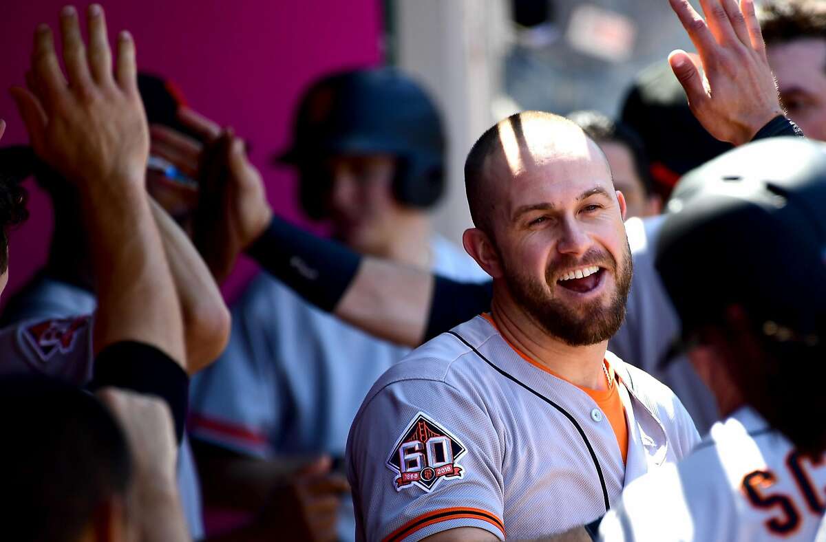 ANAHEIM, CA - APRIL 22: Evan Longoria #10 of the San Francisco Giants is greeted in the dugout after a two run home run in the third inning of the game against the Los Angeles Angels of Anaheim at Angel Stadium on April 22, 2018 in Anaheim, California. (Photo by Jayne Kamin-Oncea/Getty Images)