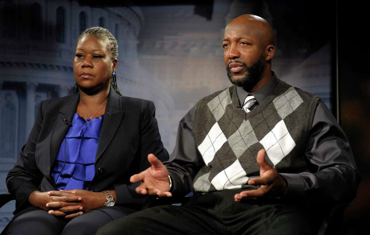 FILE - In this April 11, 2012 file photo, Sybrina Fulton, left, and Tracy Martin, parents of Trayvon Martin, appear during an interview in Washington. Six years after his death, Trayvon Martin?’s name is known throughout the country as a symbol of social injustice and a rallying cry for the Black Lives Matter movement his killing helped forge. The first part of the six-part documentary series ?“Rest in Power: The Trayvon Martin Story," will premiere Friday, April 20, 2018, at the Tribeca Film Festival. (AP Photo/Susan Walsh, File)