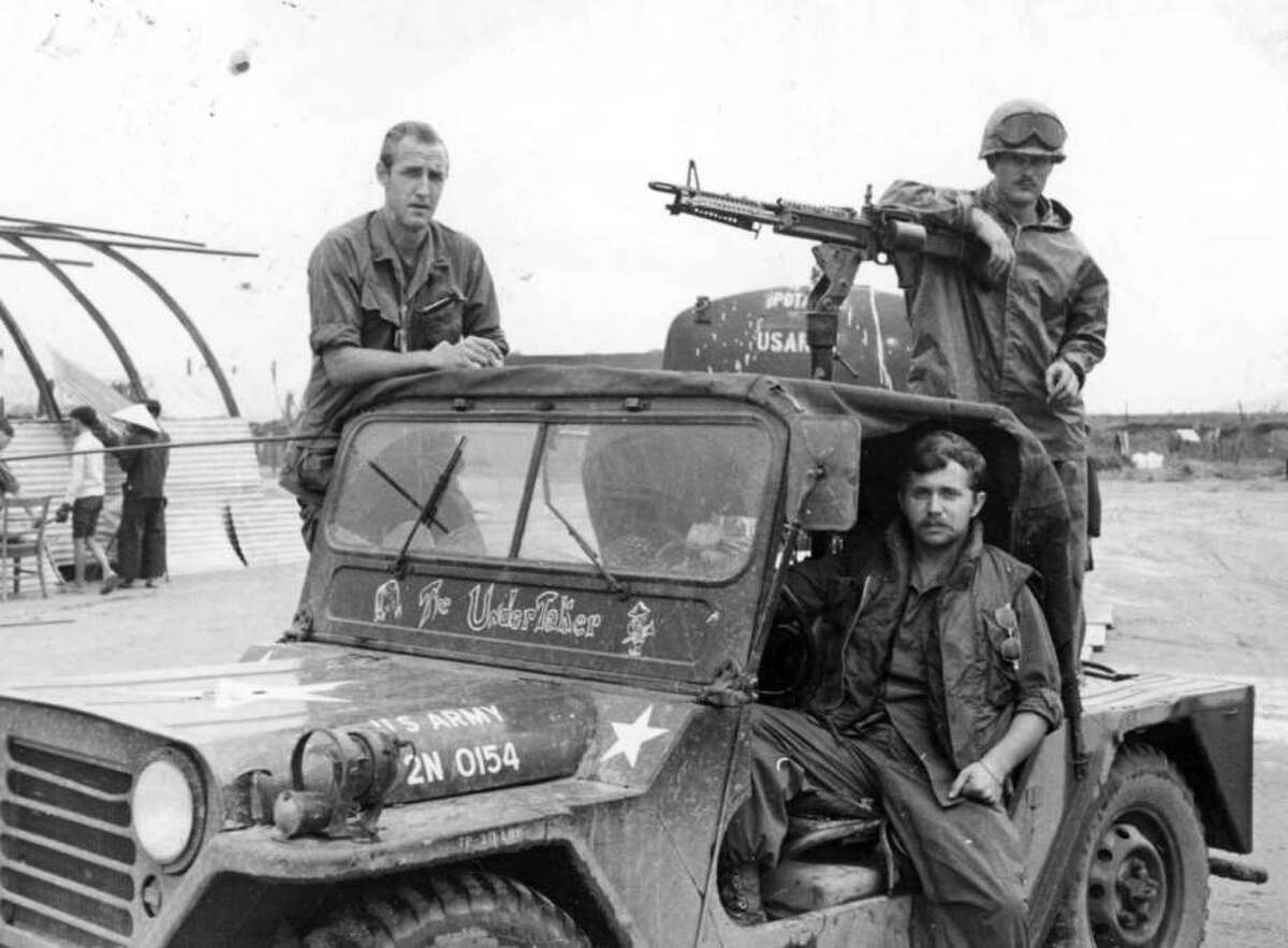 Army Spc. Frank Merges, left, Spc. 5 James McDermott, driver, and Spc. J.R. Downs, a machine gunner, are ready to lead a convoy in the Vietnam War. (Courtesy of James McDermott)