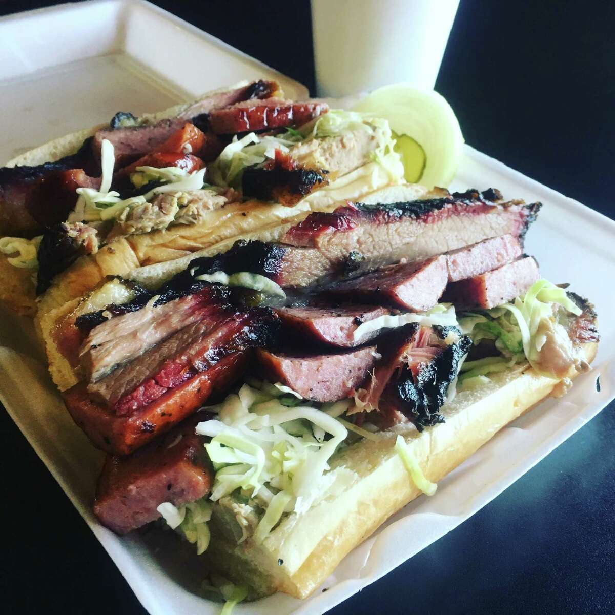 No free meals or T-shirts to the winner, but consuming the $17 “Big Smokey” would be one of San Antonio's biggest eating challenges. The 12-inch roll is layered with more than a pound of brisket, pork shoulder and sausage with marinated cabbage.
