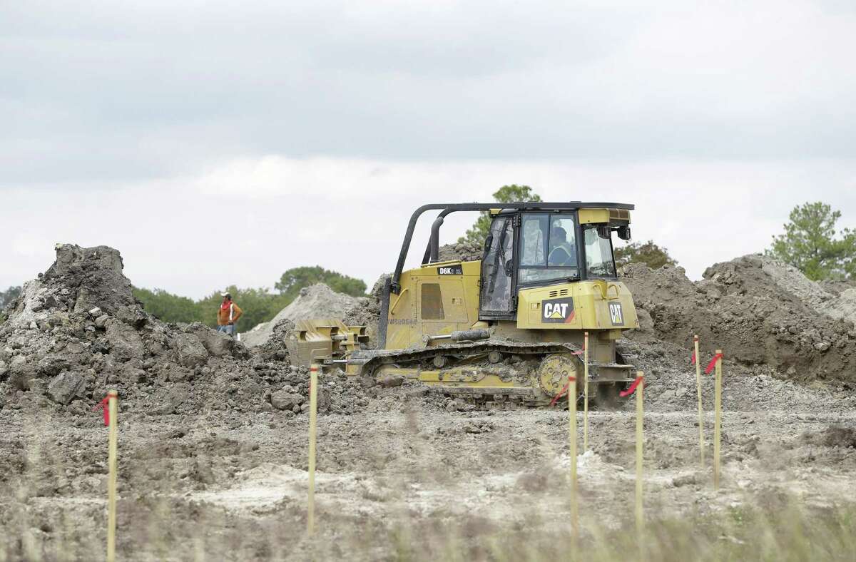 Construction is shown at the site of the of the former Pine Crest Golf Course at 3080 Gessner Road in Houston. Scottsdale, Ariz.-based Meritage Homes announced last May that it planned to build hundreds of single-family homes in a master-planned community to be called Spring Brook Village.